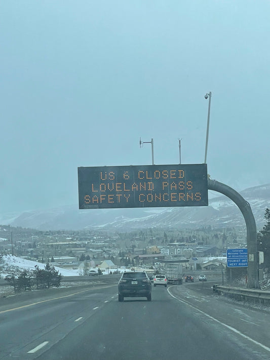 Highway sign saying Loveland Pass is closed